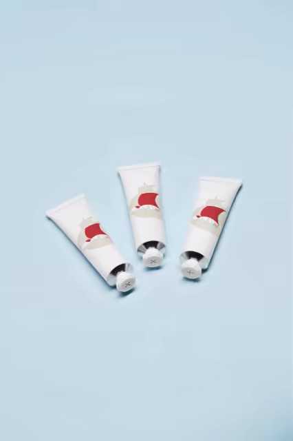 Cosmetic Tubes Mockup on a Powder Blue Backdrop