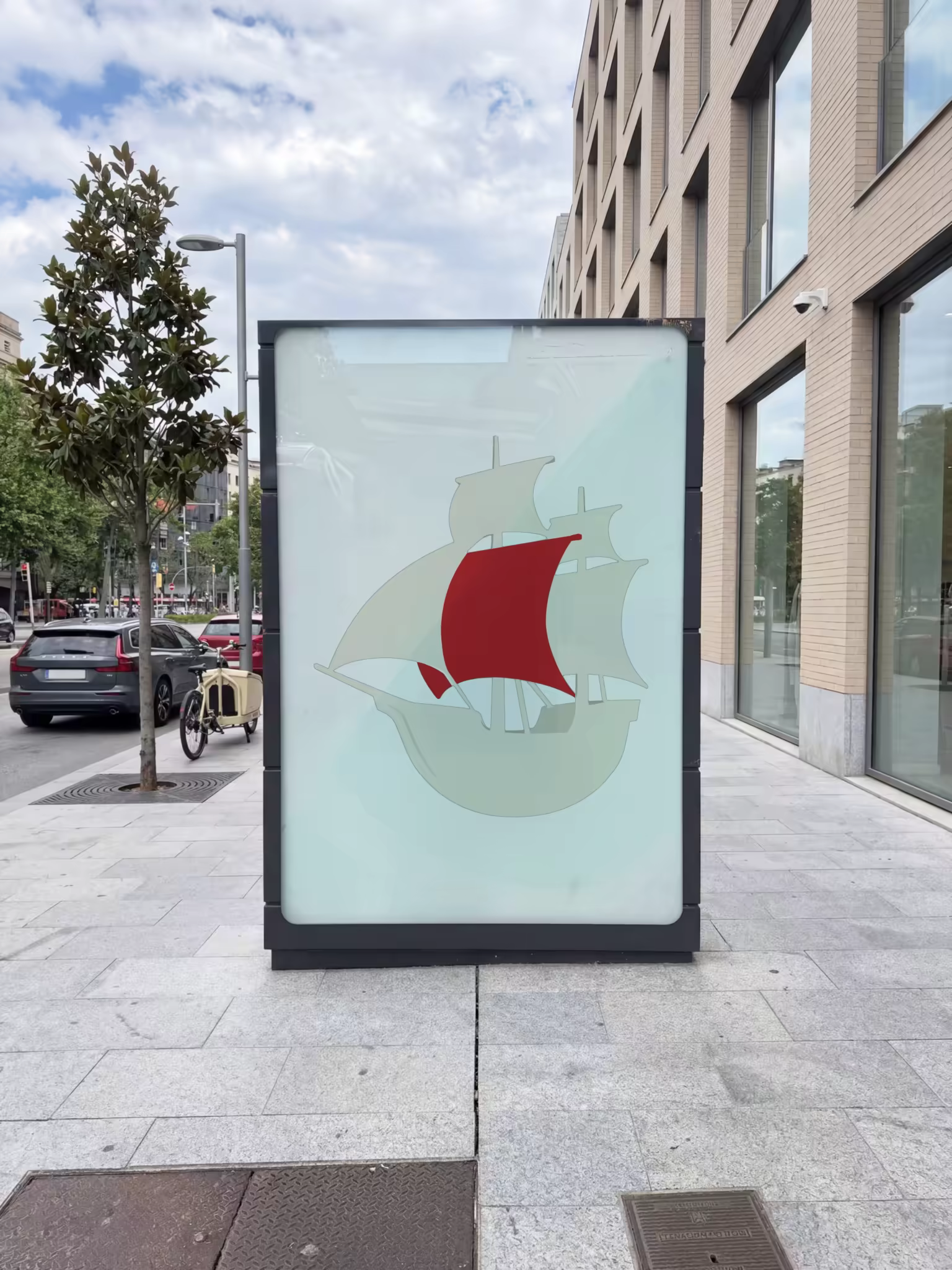 City Billboard Mockup Beside a Brick Facade