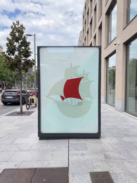 City Billboard Mockup Beside a Brick Facade