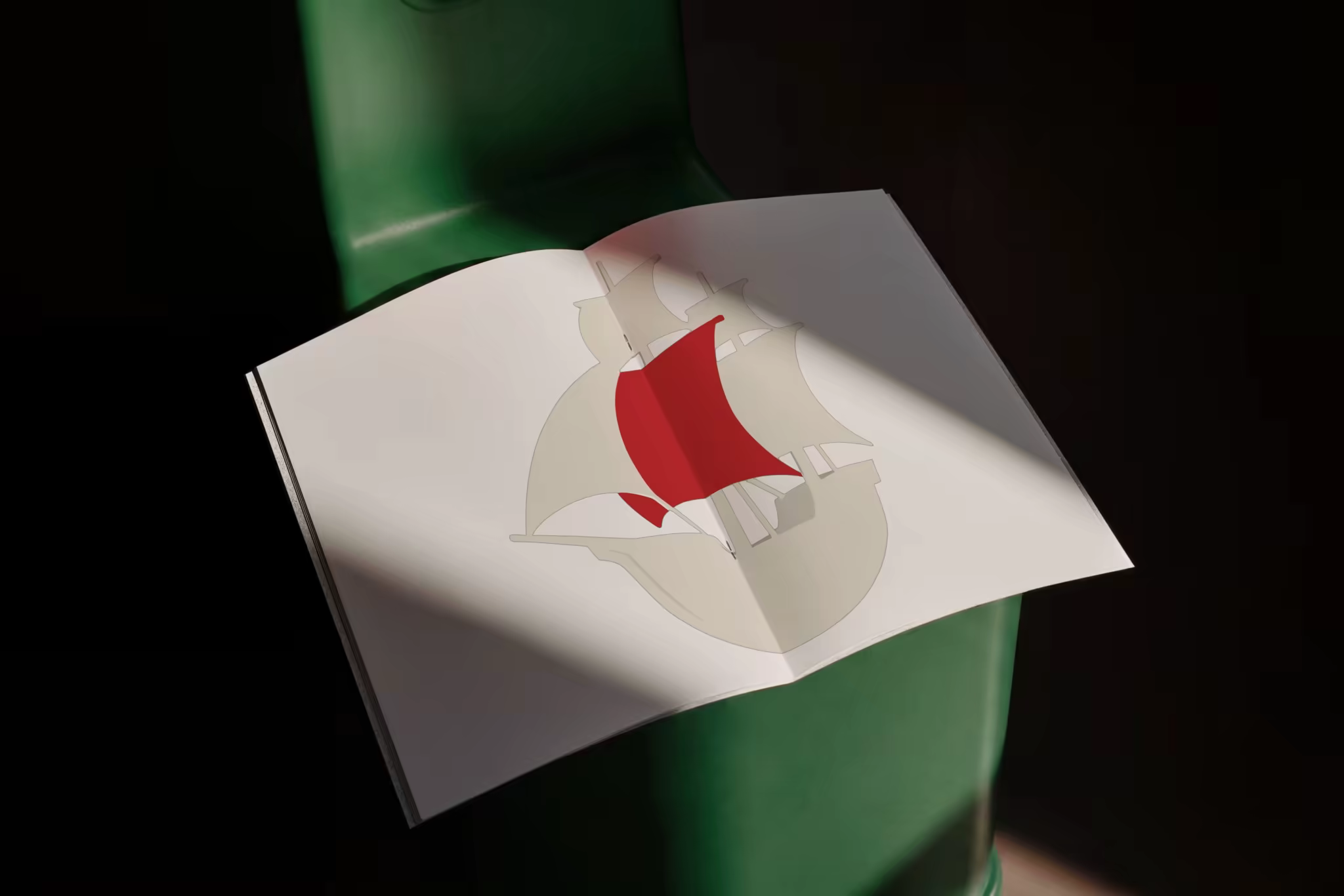 Open Booklet Mockup on a Green Metal Stool