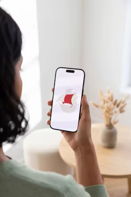 Handheld Phone Mockup in a Bright Living Room