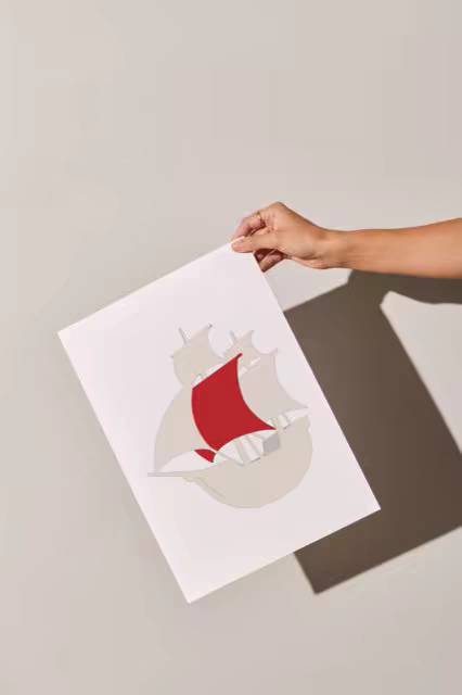 Unframed Poster Mockup Held in Hard Studio Light