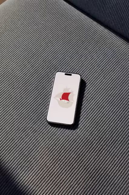 Phone Mockup on a Navy Corduroy Sofa Cushion