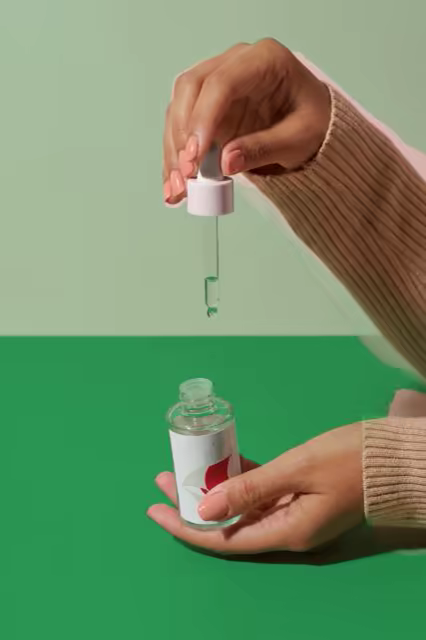 Serum Dropper Bottle Mockup on a Two-Tone Green Set