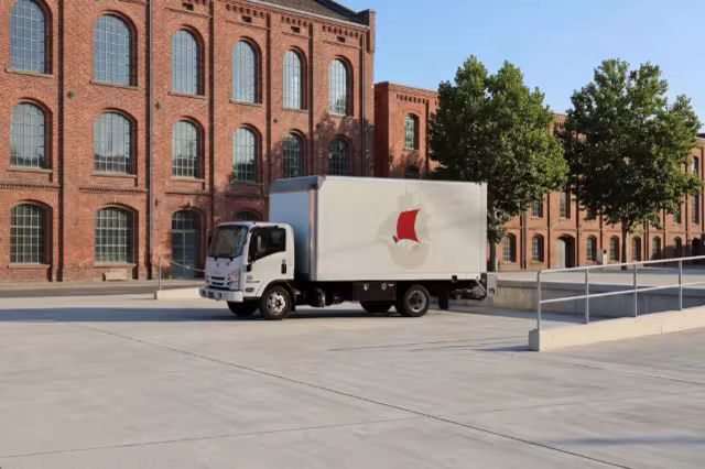 Delivery Truck Mockup by a Red Brick Warehouse