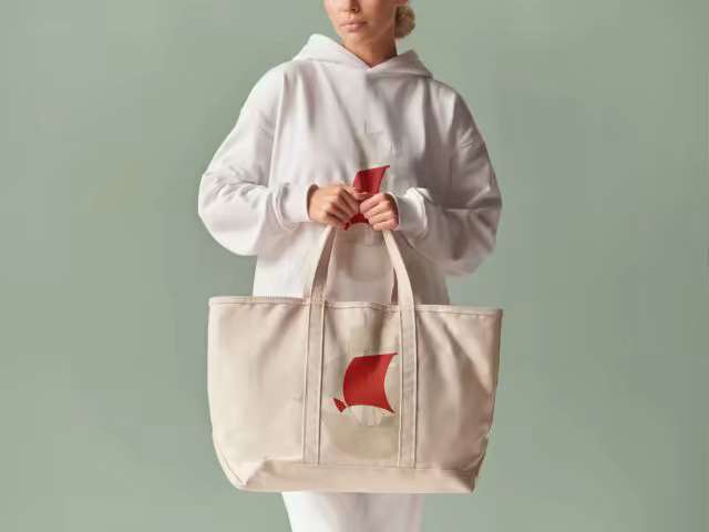 Canvas Tote Bag Mockup Held Against Sage Green