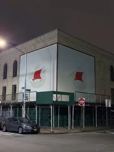 Corner Building Banner Mockup Lit at Night