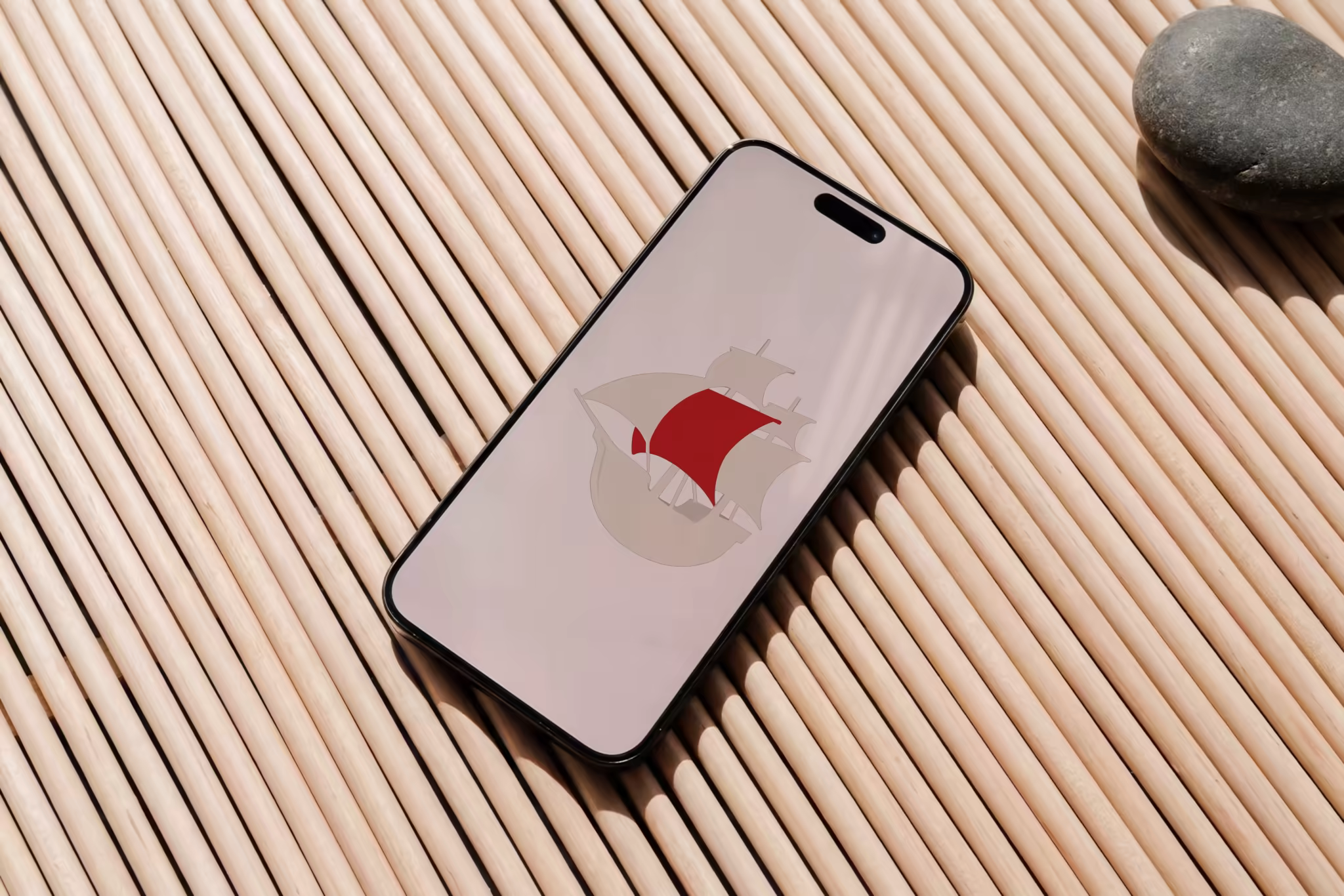 Phone Mockup on a Ribbed Wooden Mat in Warm Sun