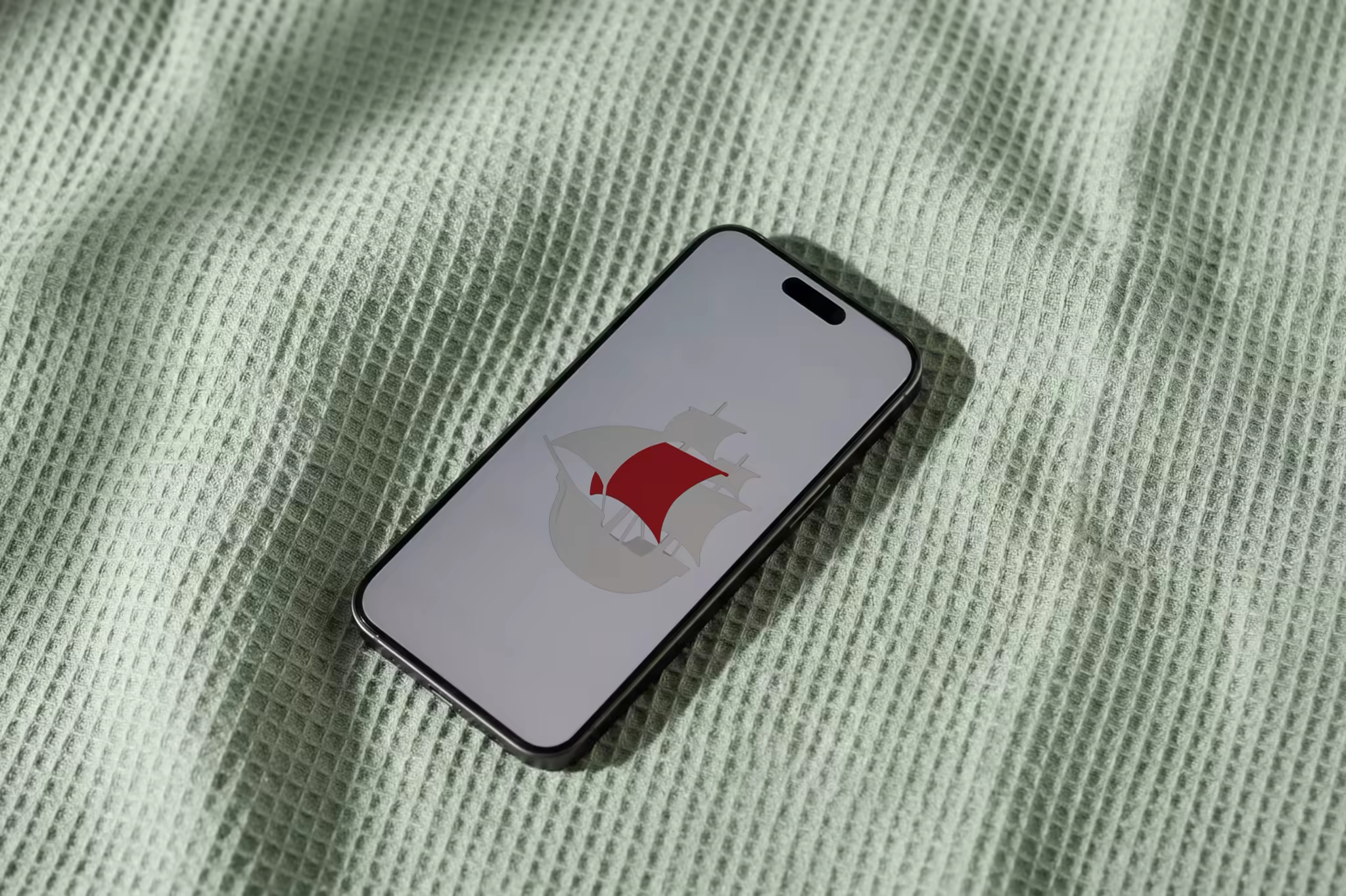 Phone Mockup on a Mint Waffle-Knit Blanket