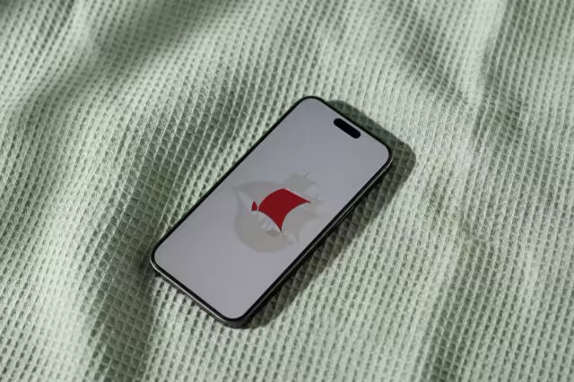Phone Mockup on a Mint Waffle-Knit Blanket