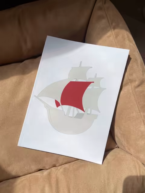 Softcover Book Mockup on a Tan Suede Sofa