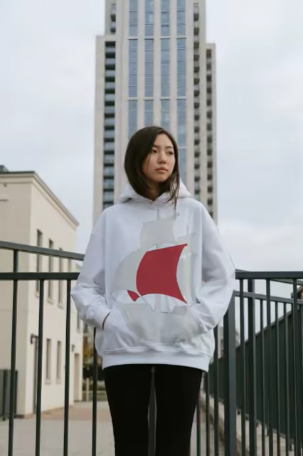 Gray Hoodie Mockup Worn by a City High-Rise