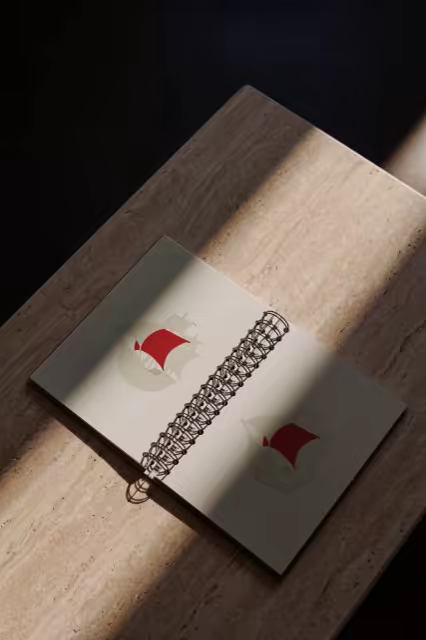 Spiral Notebook Mockup on Travertine in Raking Sun