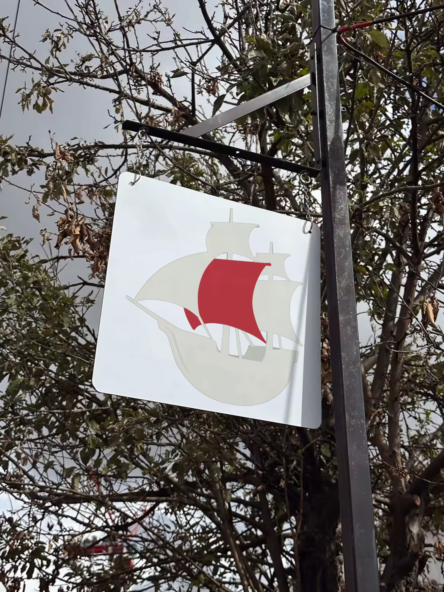 Hanging Signboard Mockup on a Black Bracket