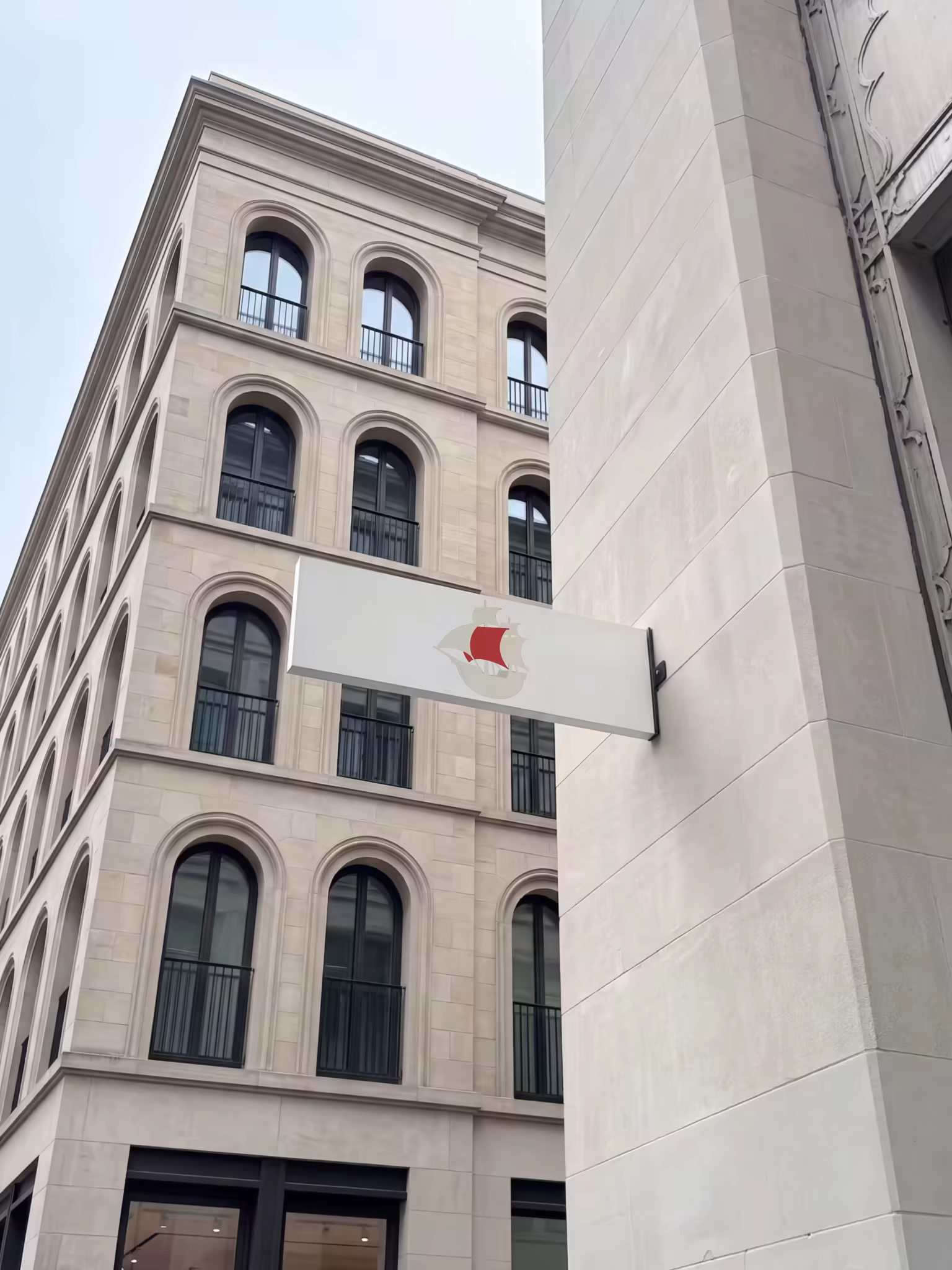 Blade Sign Mockup on a Limestone Building Corner