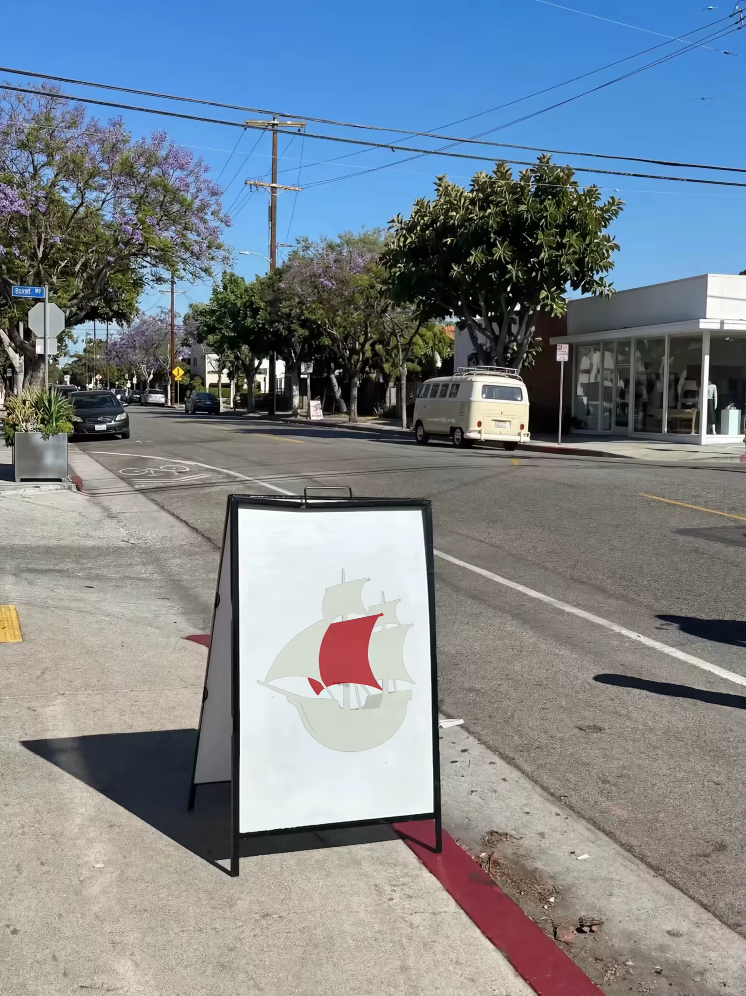 A-Frame Sign Mockup on a Sunny Sidewalk Curb