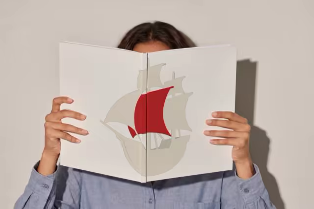 Open Hardcover Book Mockup Held Up by a Reader
