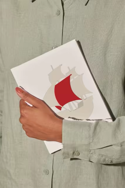 Book Mockup Carried Against a Sage Linen Shirt