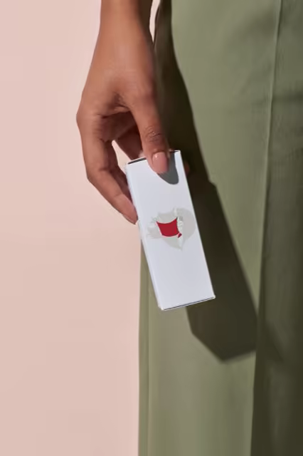 Slim Cosmetic Carton Mockup Held at the Hip
