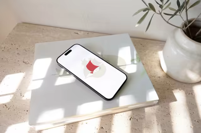 Phone Mockup on Stacked Books in Dappled Sun