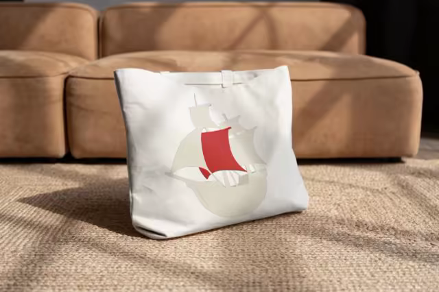 Tote Bag Mockup on Sisal by a Suede Sofa