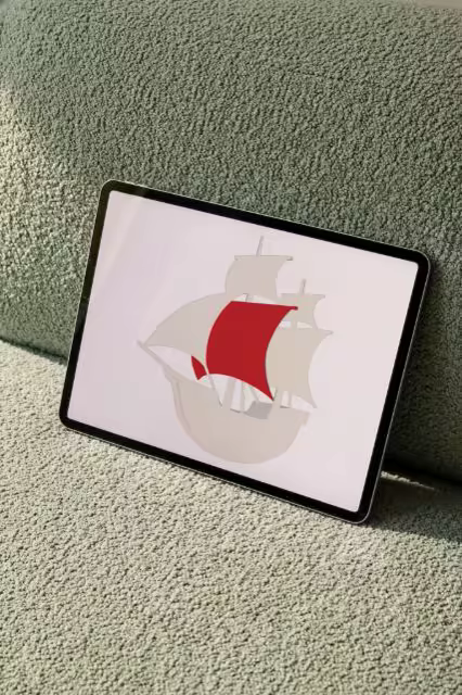 Tablet Mockup Leaning on a Sage Boucle Sofa