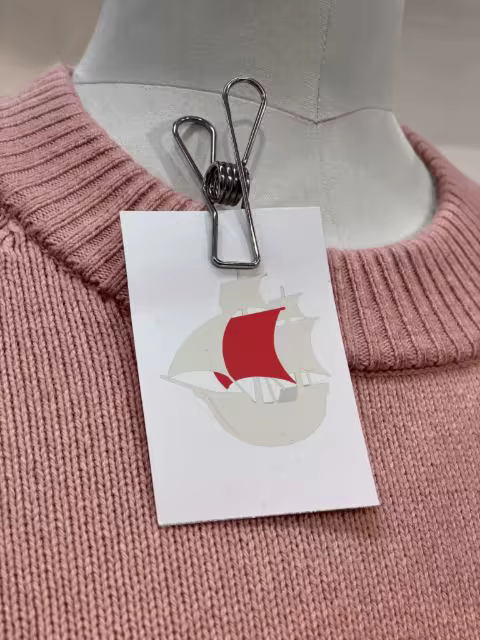 Clipped Card Mockup on a Pink Knit Sweater