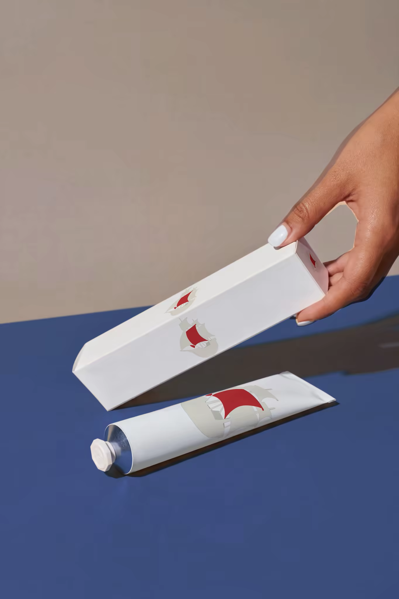 Cosmetic Tube and Carton Mockup on Navy Blue