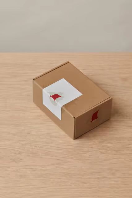 Kraft Mailer Box Mockup on an Oak Tabletop