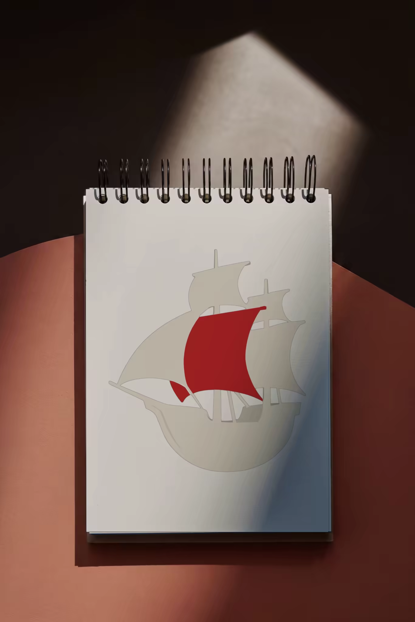 Spiral Notepad Mockup on a Terracotta Desk
