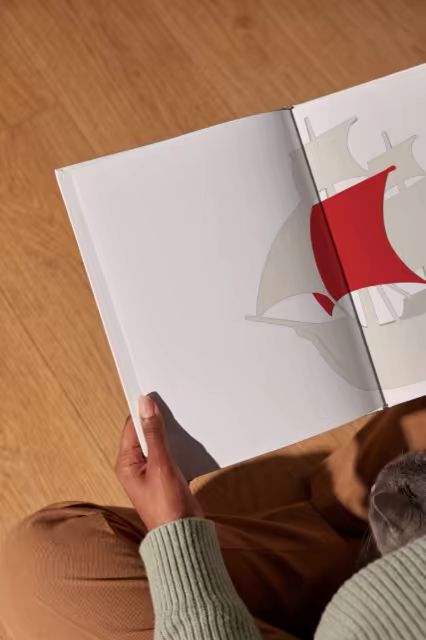 Hardcover Book Mockup Read on an Oak Floor
