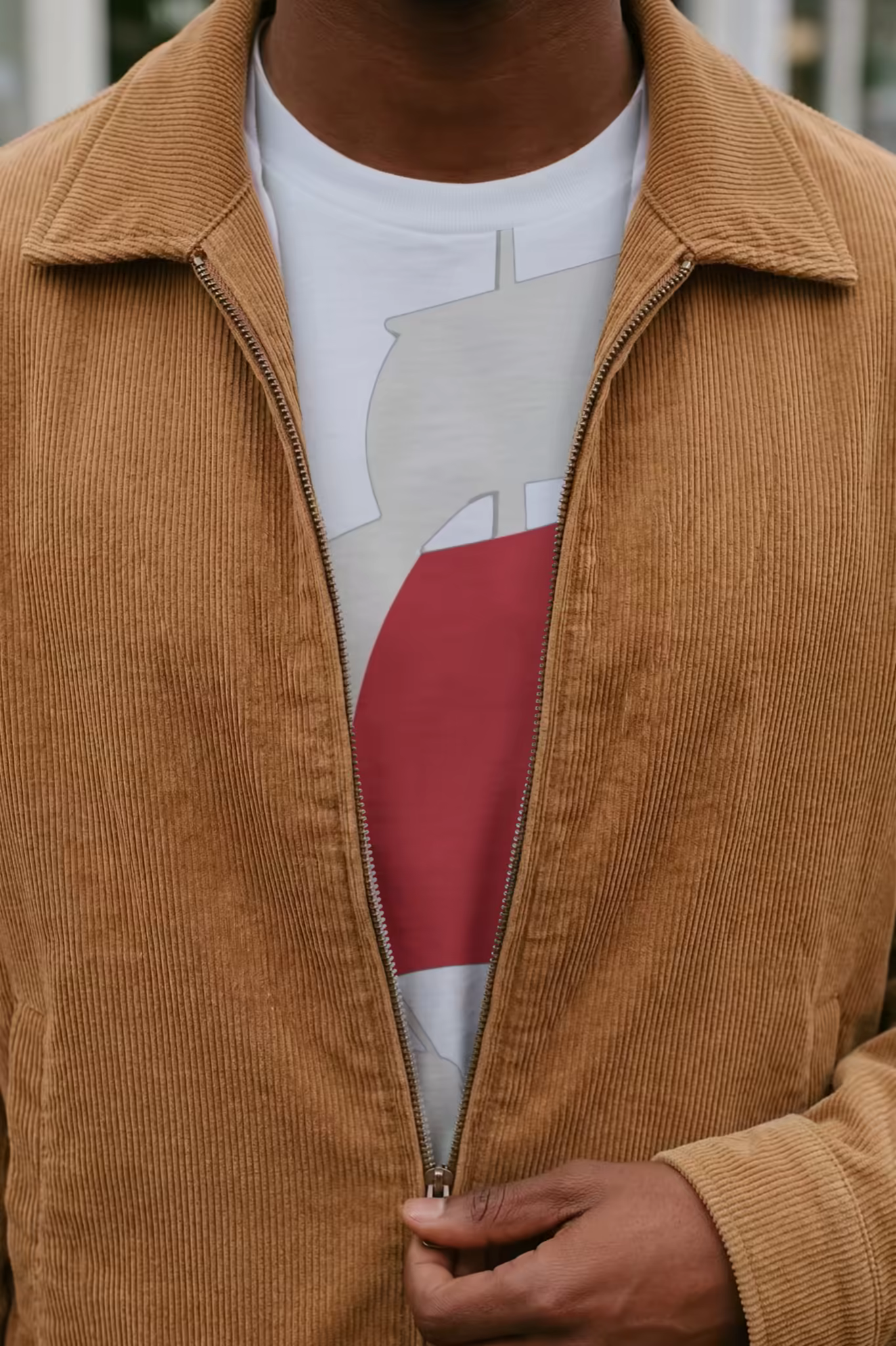 White T-Shirt Mockup Under a Corduroy Jacket