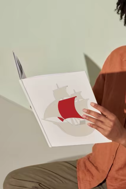 Softcover Book Mockup Held in Warm Sunlight