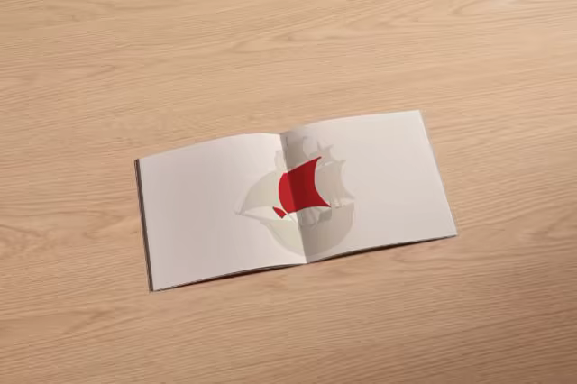 Open Booklet Mockup on a Light Oak Surface