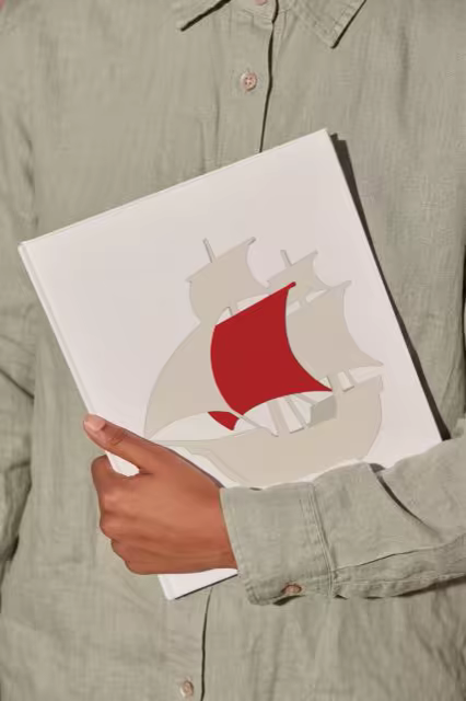 Hardcover Book Mockup Carried Under One Arm