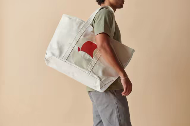 Oversized Canvas Tote Mockup Slung on a Shoulder