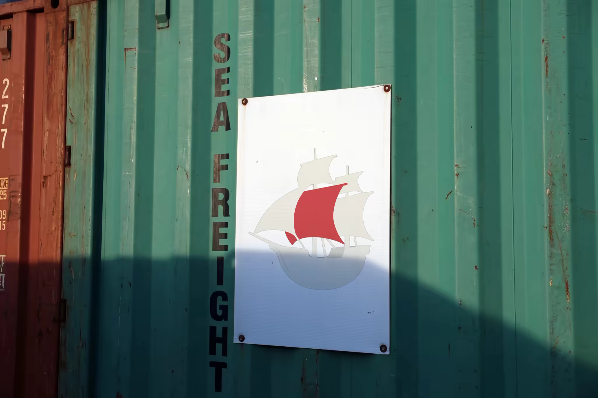 Poster Mockup Bolted to a Green Shipping Container
