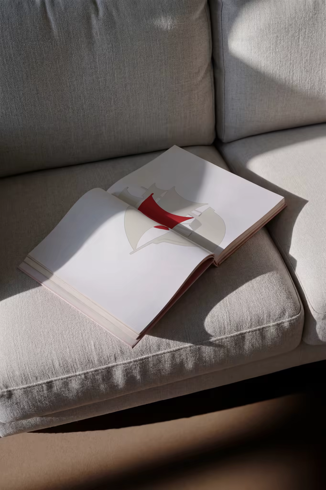 Softcover Book Mockup Open on a Linen Sofa