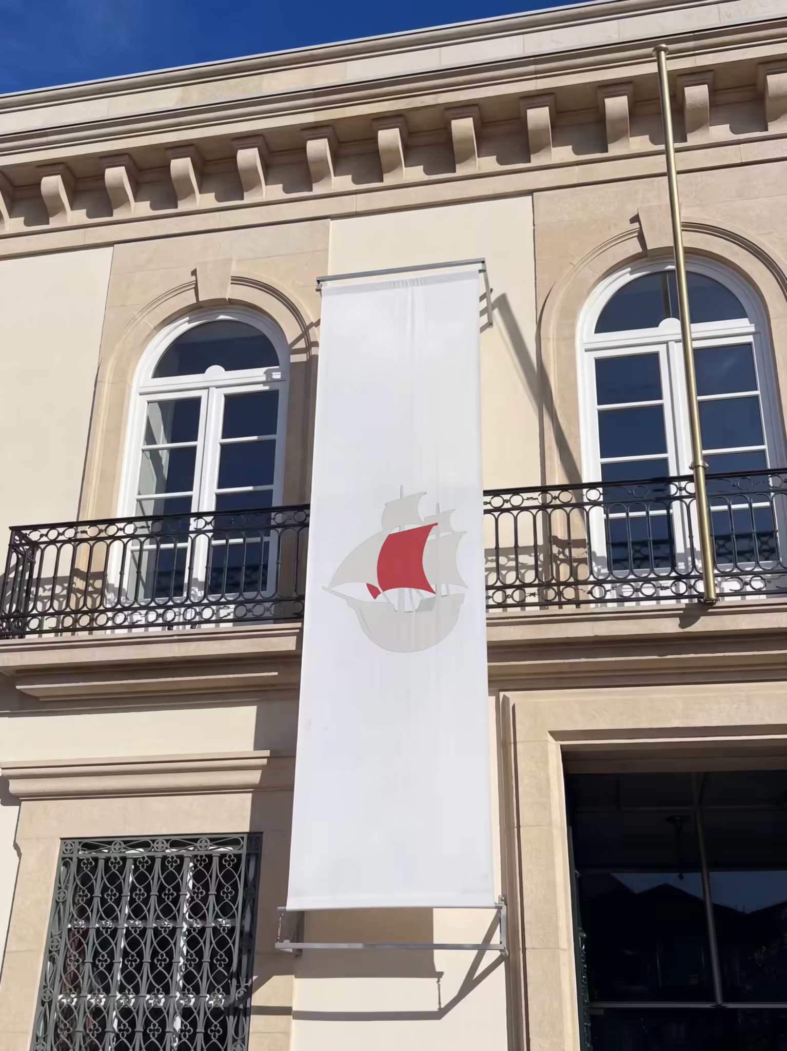Vertical Banner Mockup on a Classic Stone Facade