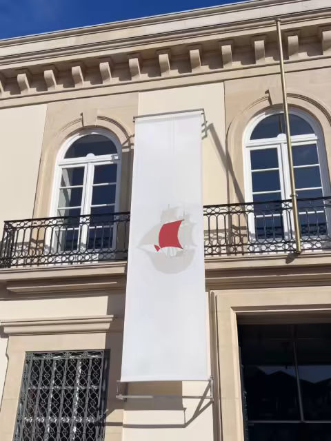 Vertical Banner Mockup on a Classic Stone Facade