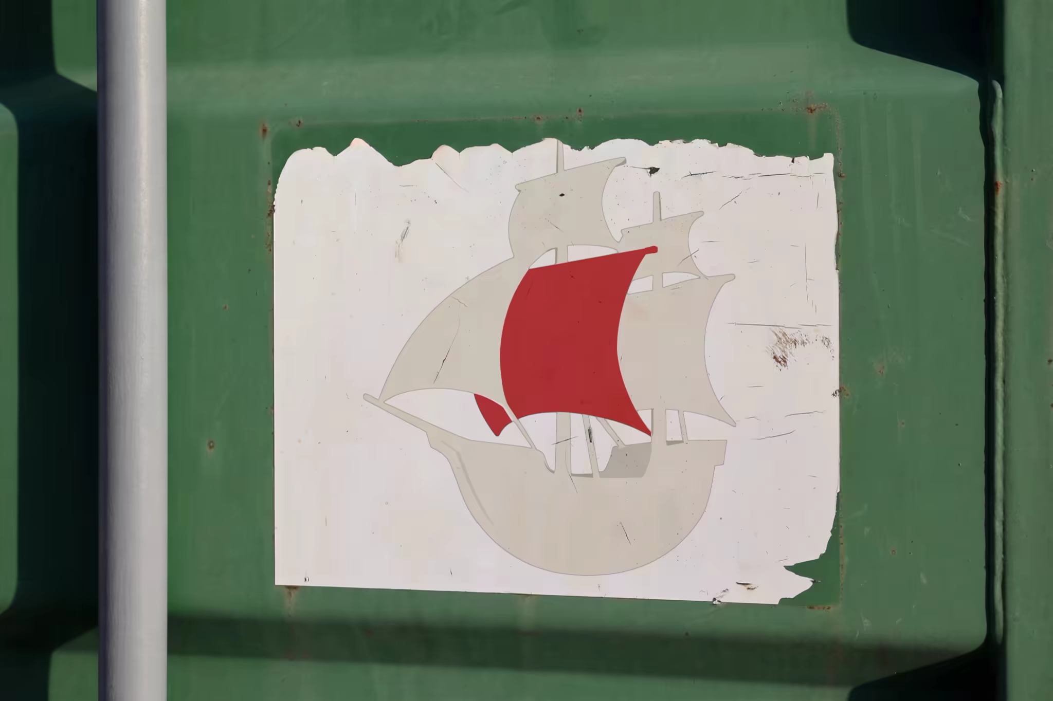 Pasted Poster Mockup on a Green Metal Container