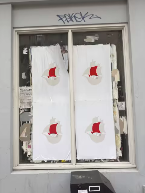 Wheatpaste Poster Mockup in an Old Shop Window
