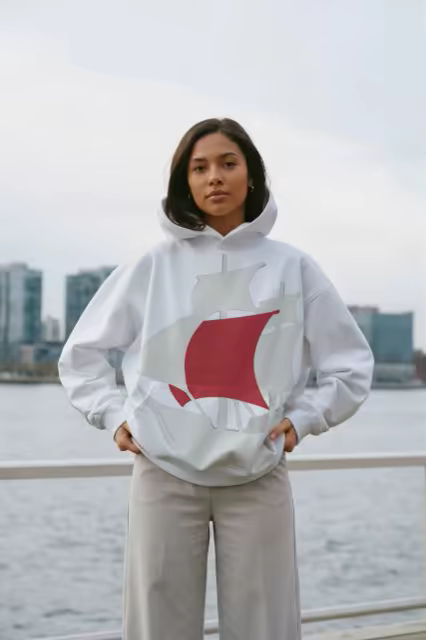 Oversized Hoodie Mockup on a City Waterfront