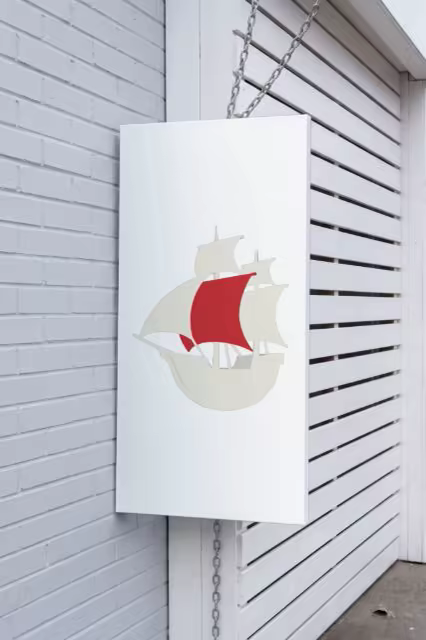 Hanging Canvas Sign Mockup on Whitewashed Brick