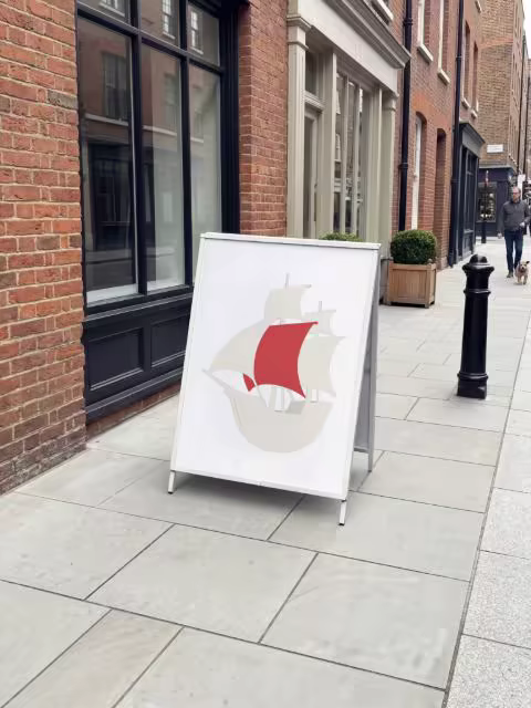 A-Frame Sign Mockup on a Brick-Lined Street