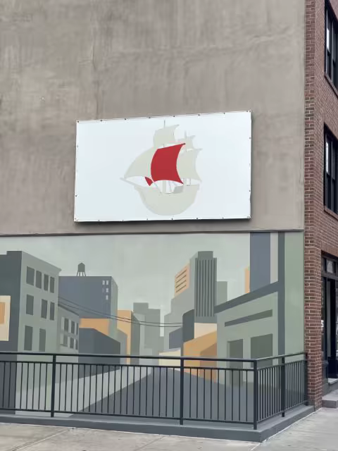 Wall Banner Mockup Above a Painted Cityscape